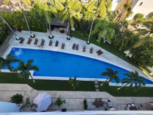 an overhead view of a swimming pool at a resort at Lovely 4 bedroom penthouse Terra PH23 QueridaEstancia in Nuevo Vallarta 