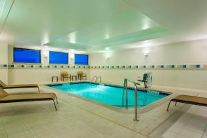 a large swimming pool in a hotel room at Courtyard by Marriott Little Rock Downtown in Little Rock