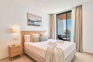 リンコン・デ・ラ・ビクトリアにあるRincón Mediterráneoのベッドルーム1室(ベッド1台付)が備わります。