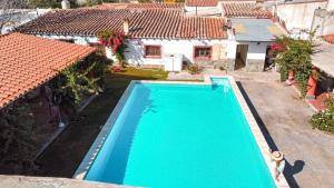 an overhead view of a swimming pool in front of a house at El Hospedaje in Cafayate +37 photos