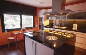 a kitchen with a sink and a counter top at Amazing Home In Santa Susanna With Kitchen in Santa Susanna