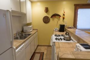 a kitchen with a sink and a stove top oven at 4081 Ski Trails in Truckee