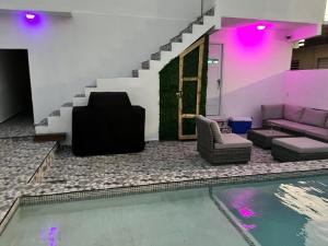 a living room with a pool and a couch at Portobelo in San Juan
