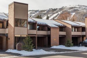 a large building with snow on the roof at Park Avenue Upgraded 2 Bedroom Condominiums in Park City