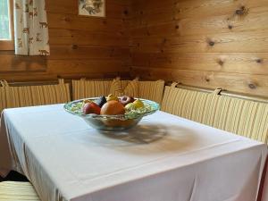 a bowl of fruit sitting on a table at Cozy holiday home on a horse farm in the Lüneburg Heath in Eschede