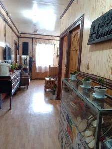 a room with a kitchen and a living room at Koreen Guest House in Banaue