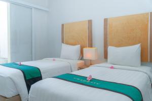 Voodi või voodid majutusasutuse Umadhatu Resort by Amerta toas