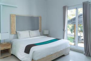 Voodi või voodid majutusasutuse Umadhatu Resort by Amerta toas