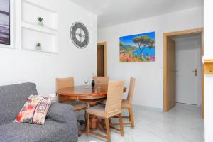 a dining room with a wooden table and chairs at Apartments with WiFi Split - 20900 in Split