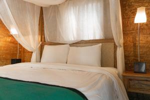 Voodi või voodid majutusasutuse Umadhatu Resort by Amerta toas