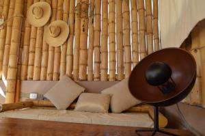 a room with a couch with hats on the wall at Casa CORAZON DE LEÓN AQP in Arequipa