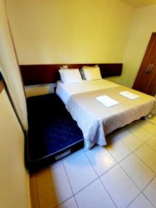 Cama ou camas em um quarto em América Flat Taperapuã