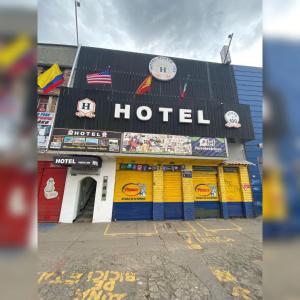 a hotel sign on the side of a building at Hotel Punto 100 in Bogotá