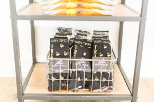 a metal shelf with a rack of wine bottles on it at Happy Trails BnB in Tropic