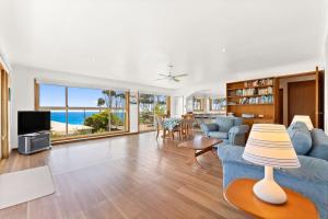 a living room with a view of the ocean at 3 Bay Lane in Narooma