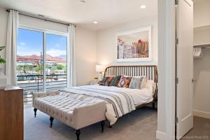 a bedroom with a bed and a large window at Eagle On The 8th 2283 - 7 Bed, Private Pool- Hot Tub With Mounta in Washington +56 photos