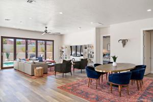 a living room with a couch and a table and chairs at Eagle On The 8th 2283 - 7 Bed, Private Pool- Hot Tub With Mounta in Washington