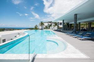 a swimming pool on the roof of a house at The View Phuket in Kata Beach