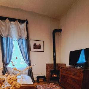 En TV eller et underholdningssystem på Vasiliki Guest House