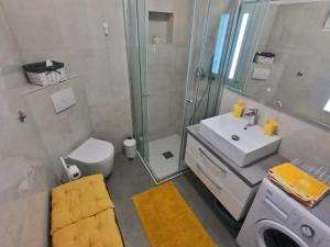 a bathroom with a sink toilet and a shower at Apartment Beautifull View in Rabac