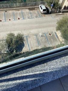 an aerial view of a parking lot with a white van at Apartment Beautifull View in Rabac +19 photos