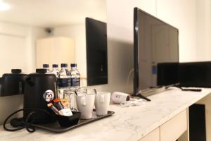 Příslušenství pro přípravu čaje a kávy v ubytování View Place Hotel & Residence