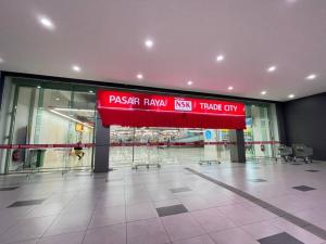 an empty lobby with a red sign in a building at 3Element*CornerUnit*Goodview* *NSK*Aeon*wifi in Seri Kembangan