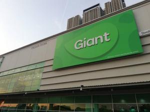 a giant sign on the side of a building at 3Element*CornerUnit*Goodview* *NSK*Aeon*wifi in Seri Kembangan
