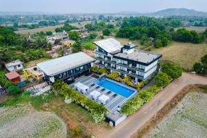 an aerial view of a house with a swimming pool at Crystal Village in Nagoa-Bardez