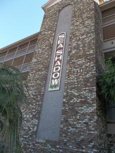 a sign on the side of a brick building at Sea Shadow 205 Condo in Myrtle Beach