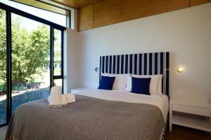 Voodi või voodid majutusasutuse On The Edge Luxury toas