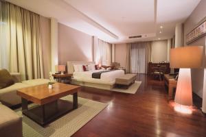 Ein Bett oder Betten in einem Zimmer der Unterkunft Javana Royal Villas