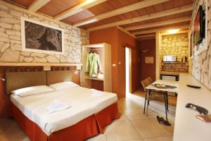 Voodi või voodid majutusasutuse Albergo Garni Orchidea toas