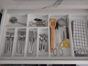a drawer filled with lots of kitchen utensils at Albolafia junto Puente Romano in Córdoba