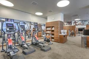 a gym with bikes and exercise equipment in a room at Gorgeous Suite Vdara 22nd FLR - POOL View - FREE Valet in Las Vegas
