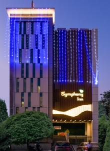 a building with a samsung sign on the side of it at Symphony Inn in Vellore