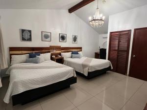 Cama o camas de una habitación en Hotel Casa del Sol