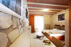 Voodi või voodid majutusasutuse Albergo Garni Orchidea toas