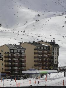 snow covered mountains and a ski slope at LCB Apartaments Pas de la Casa in Pas de la Casa