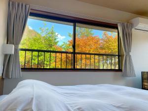 Una cama o camas en una habitación de 雅・小涌谷　温泉別荘　Miyabi Kowakudani Hopspring Villa