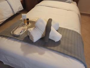 A bed or beds in a room at AB Preveza Apartments -15 Meters Over the Sea