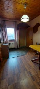 an empty room with a table and a window at Holiday Home at Fedkovycha St. in Kyiv