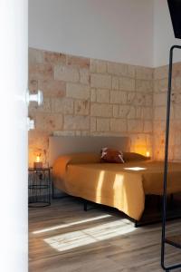 A bed or beds in a room at Apulian House
