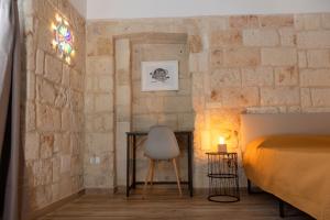 A bed or beds in a room at Apulian House