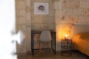 A bed or beds in a room at Apulian House