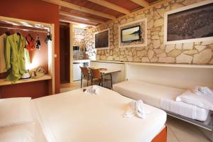 TV a/nebo společenská místnost v ubytování Albergo Garni Orchidea