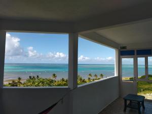 a room with a view of the ocean at La Terrasse in Rodrigues Island