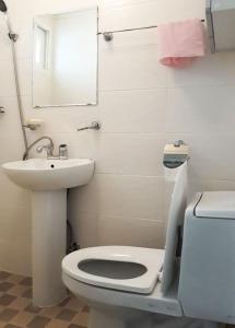a bathroom with a toilet and a sink and a mirror at Sam House 154 - Center of SEOUL in Seoul +11 photos