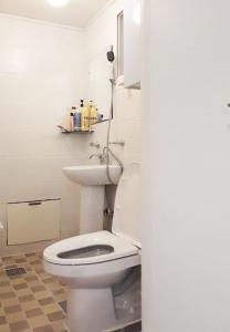a bathroom with a white toilet in a room at Sam House 154 - Center of SEOUL in Seoul