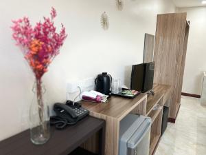 TV a/nebo společenská místnost v ubytování CottagePine Rayong Resort&Cafe